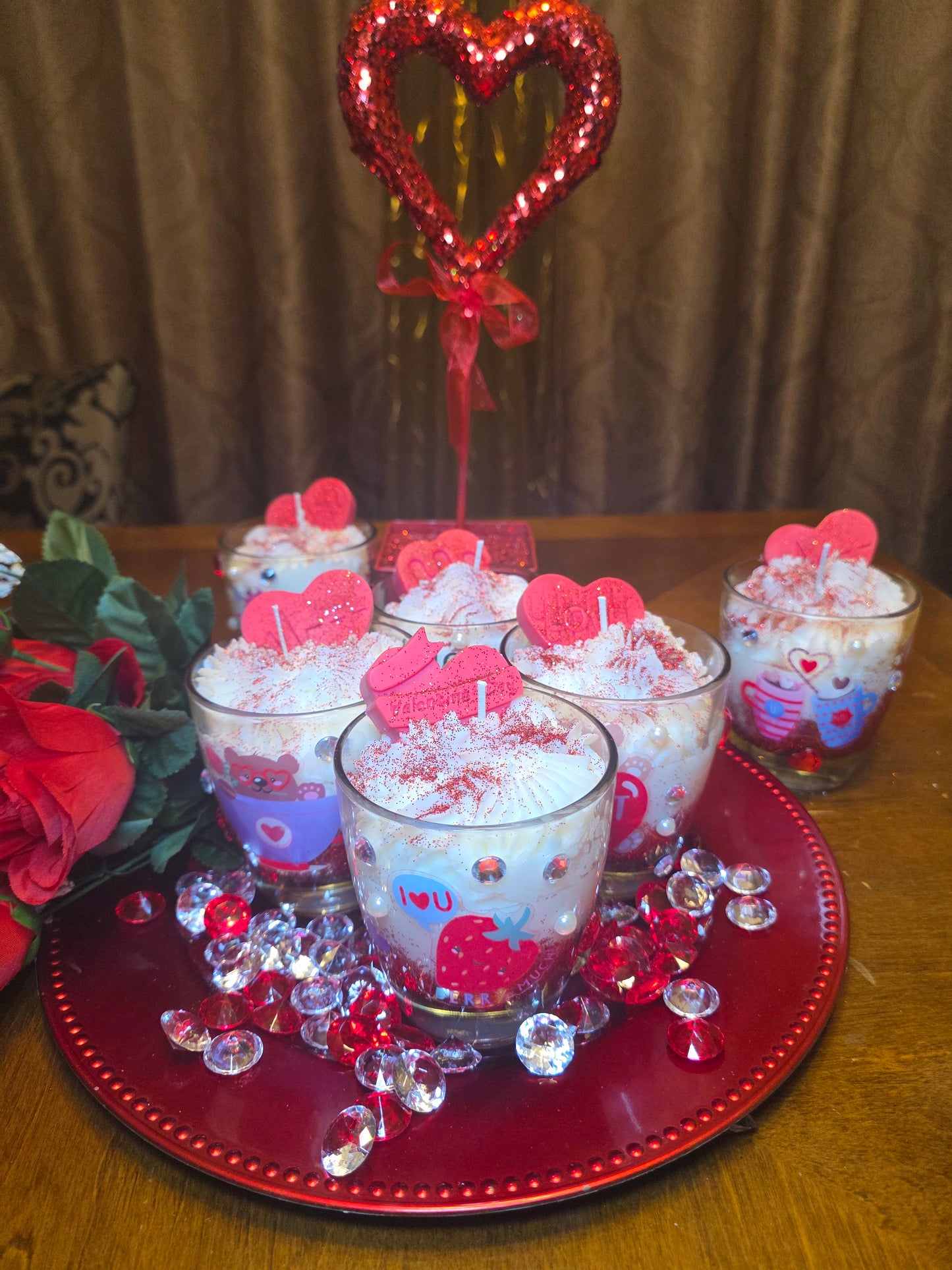 Decorative glassware with red and white design on a red plate. Red Hearts. Diamond Studded.