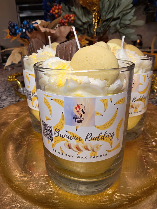 Banana pudding-themed candle with decorative elements on a gold surface