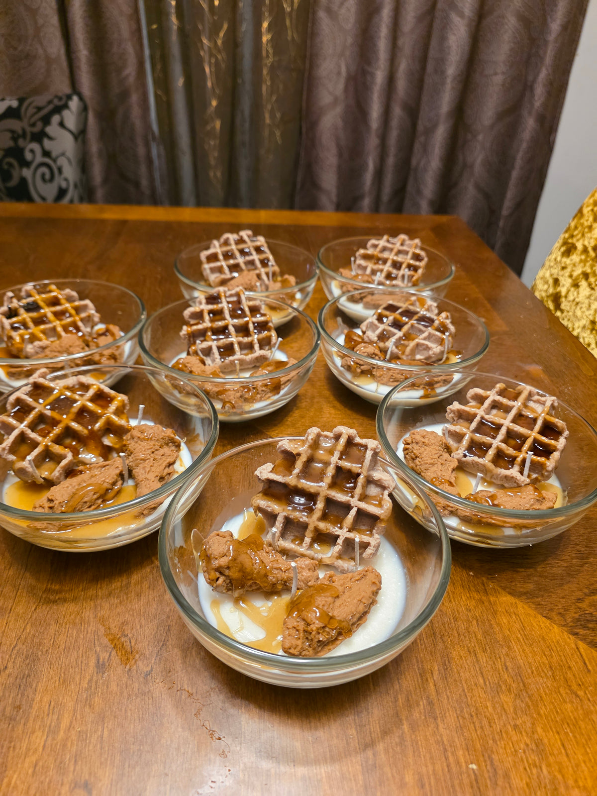 Glass bowls with waffle-like dessert on a wooden surface