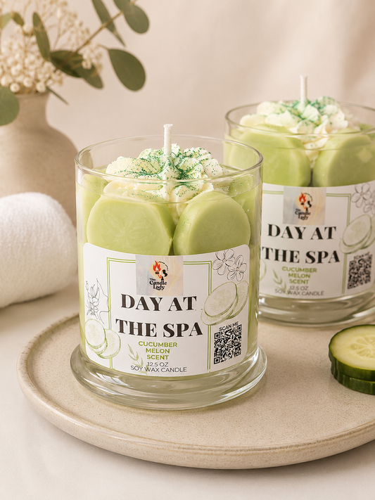 Cucumber Melon scented candle sitting on a tray in a spa-like scene. 