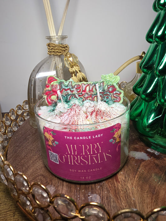 Decorative candle with a festive label on a decorative stand.