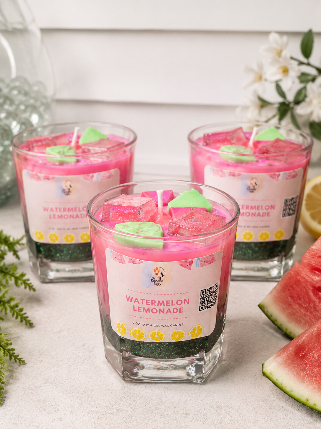 Watermelon Lemonade scented candle surrounded by juicy watermelon 