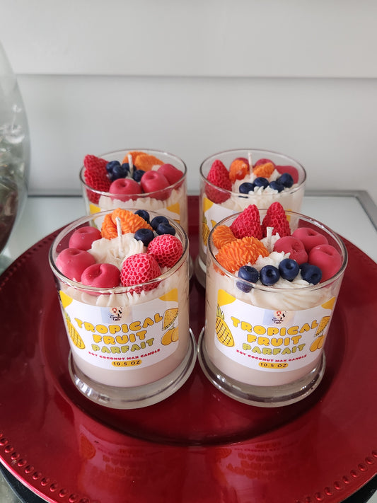 Two containers of candle wax fruit on a red surface